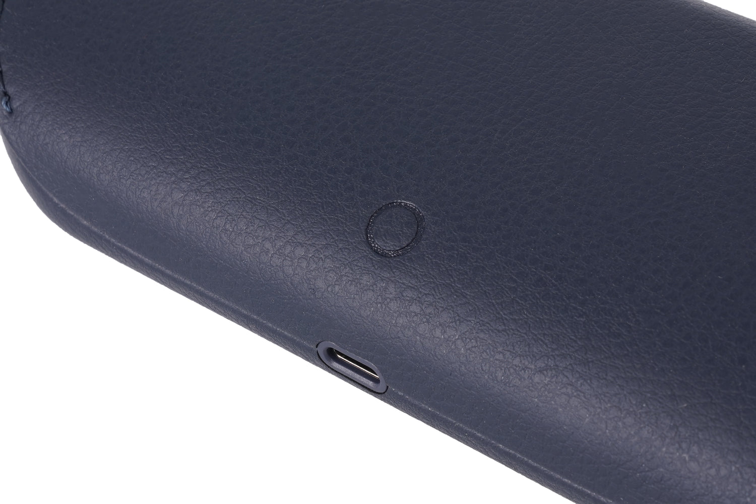 The back of the blue charging case features a raised button