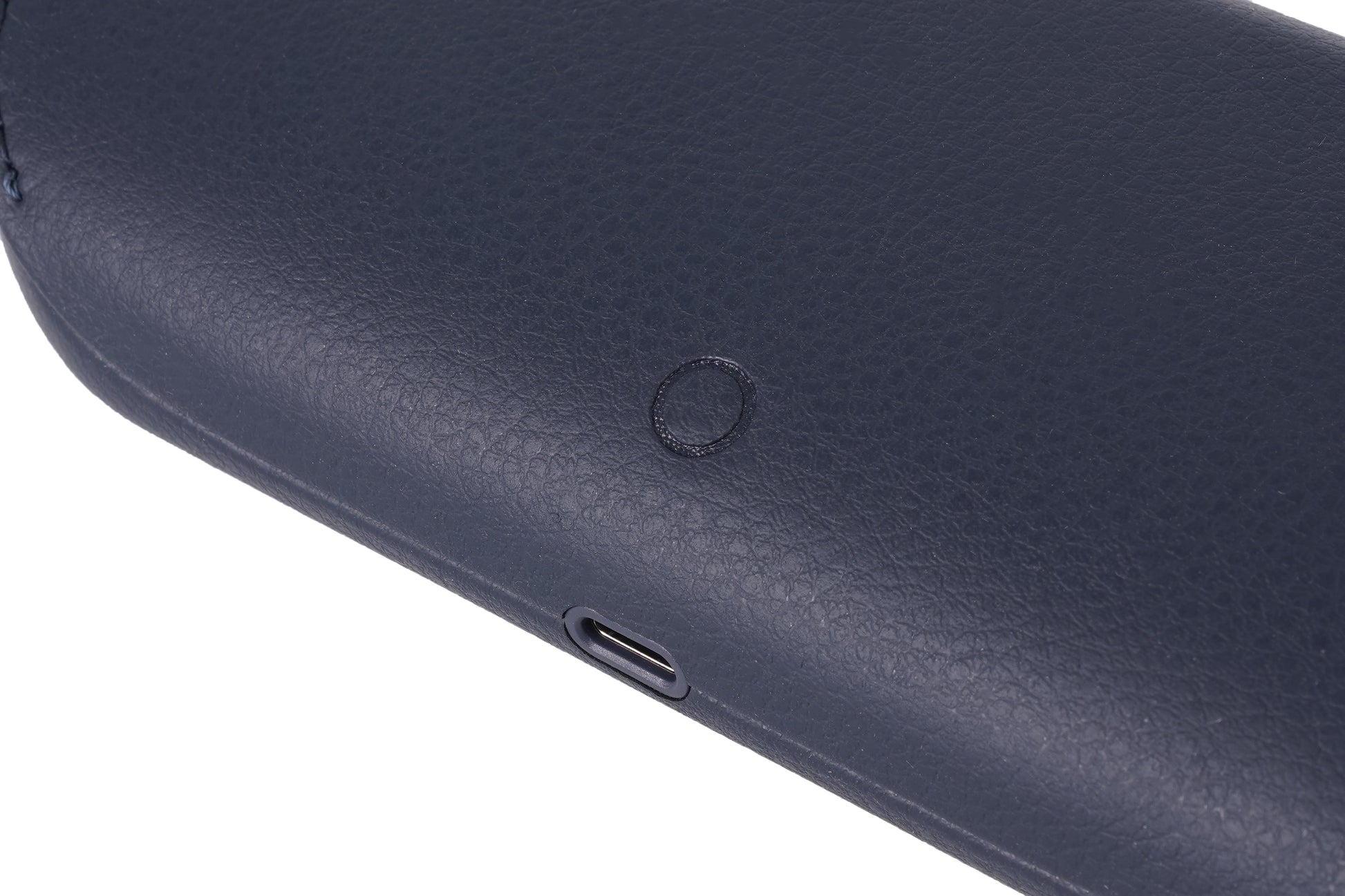 The back of the blue charging case features a raised button